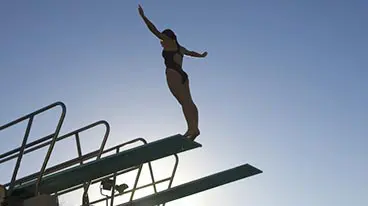 woman competitive diving from height